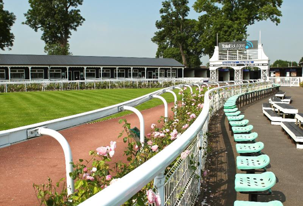 A close up shot of the fencing at Uttoxeter Racecourse with a blue sky above.